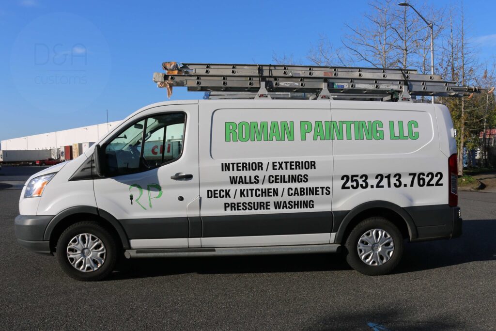 Technician installing high-quality vinyl wraps for van