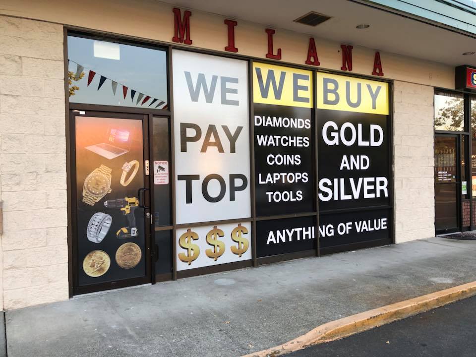 Retail window display with promotional vinyl graphics