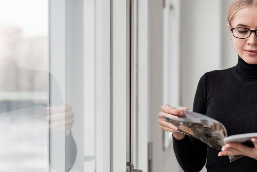 Woman enjoying sunlight indoors with glare reduced by 3M Prestige Film